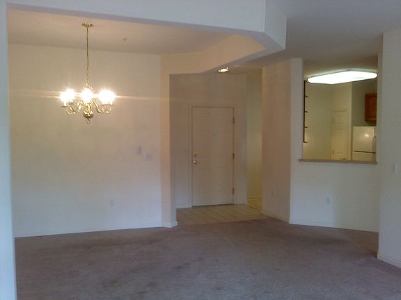 Dining room looking into foyer and kitchen