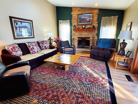 Handsome floor-to-ceiling wood-burning FP