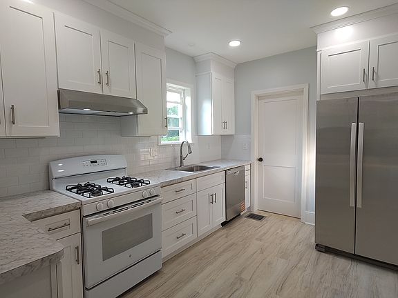 Brand New Kitchen Cabinetry, Counters, Backsplash, DW & Refrigerator