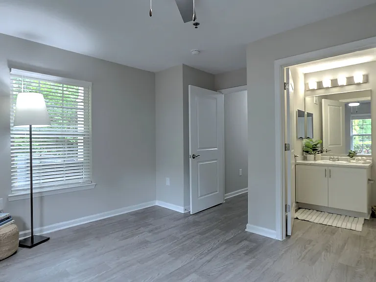 Luxe primary suite with adjoining bathroom for your own private haven.