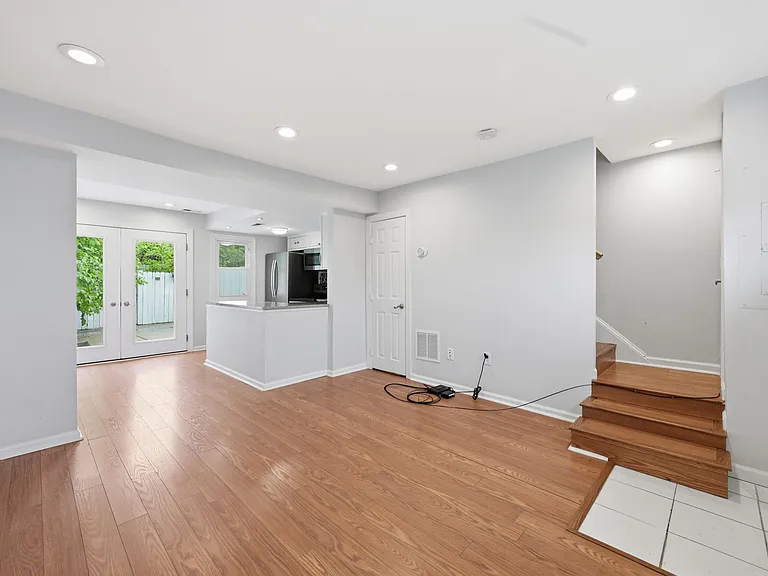 Bright Open-Concept Living Room with Hardwood Floors