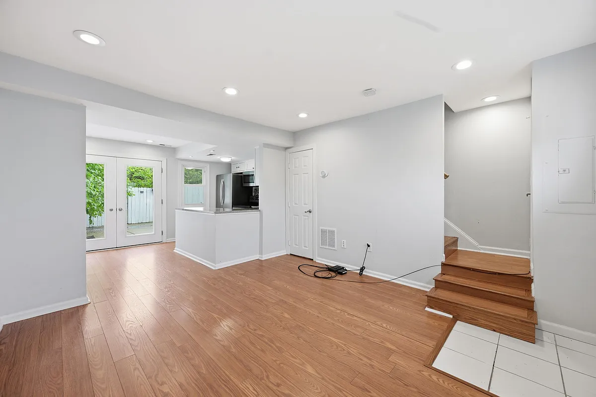 Bright Open-Concept Living Room with Hardwood Floors - 1151 Summit St NE