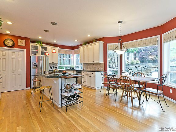 Large kitchen with breakfast bar and nook. Granite counters,stainless appliances and a large pantry.