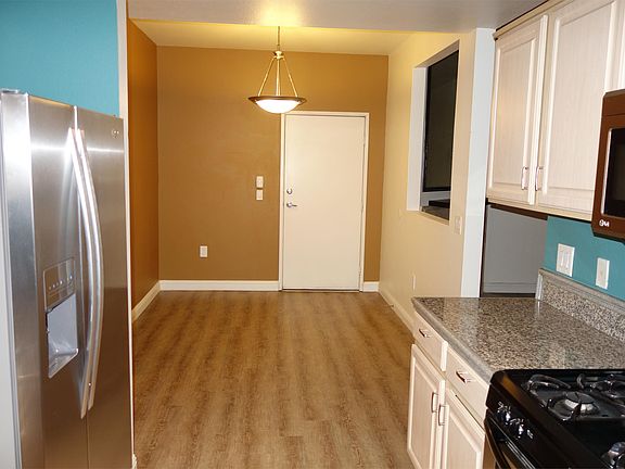 Kitchen looking into Dining Room (Door Leading to Attached Garage)