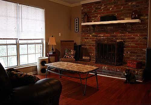 Living Room with Brick Fireplace, Cherry Hardwood Floor