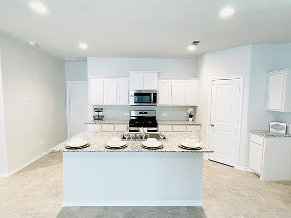 Kitchen - All Home and community information, including pricing, included features, terms, availability and amenities, are subject to change at any time without notice or obligation. All Drawings, pictures, photographs, video, square footages, floor plans, elevations, features, colors and sizes are approximate for illustration purposes only and will vary from the homes as built.