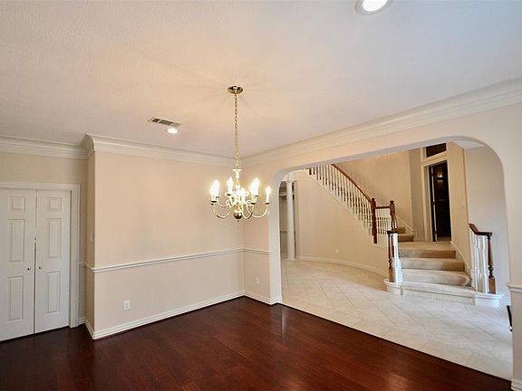 View From Dining Room Up Curved Stairway.