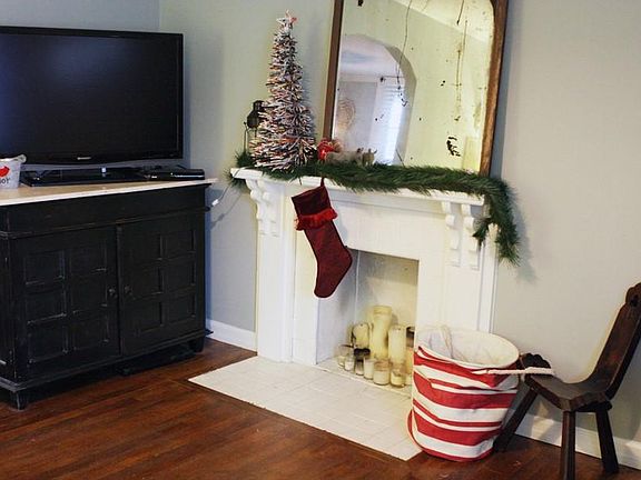 Living room with historic/decorative fireplace (not suitable for wood burning)
