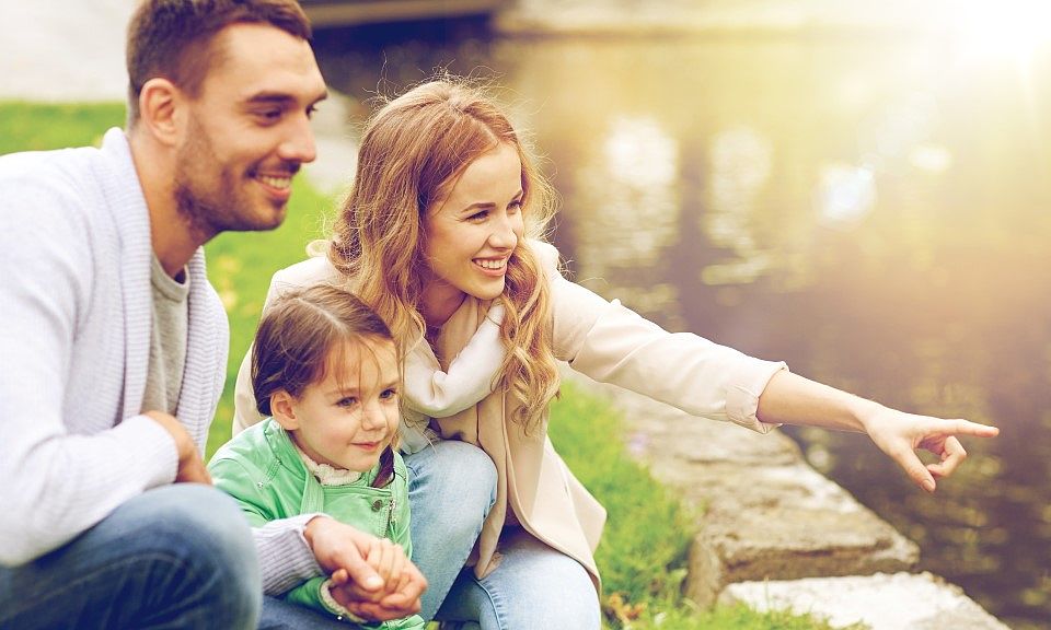 young family near pond