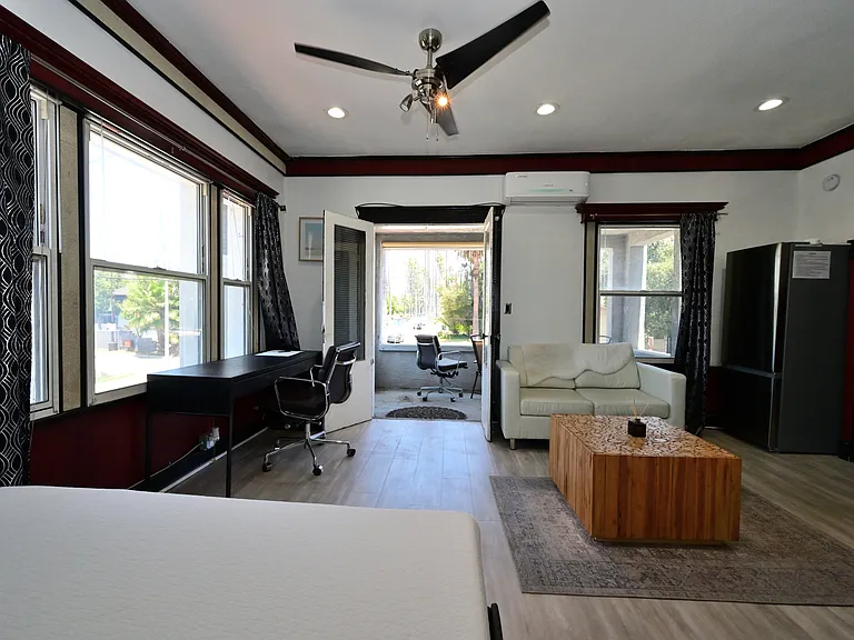 Fully Furnished & Updated LARGE and BRIGHT Studio w/ in-unit laundry + private balcony + parking