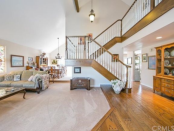 Entry Foyer with views of the step down living room and dining room.
