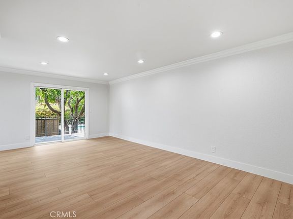 4th image of 7439 Woodman Ave Unit 54