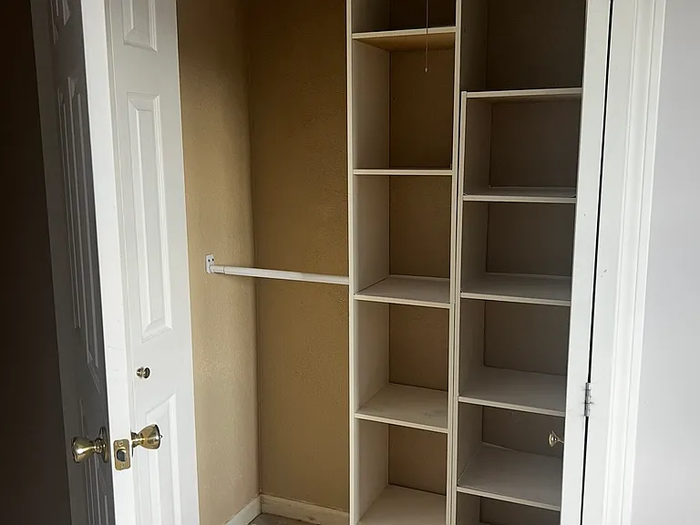 bedroom #3 closet with built in storage system