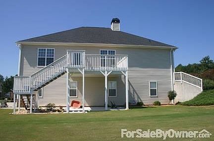 REAR VIEW OF HOME
						:
						STAINED UPPER DECK OFF KITCHEN / ANDERSEN STORM DOOR