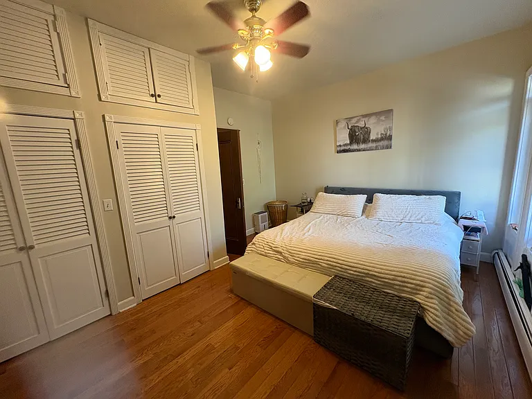 You walk up the stairs and turn to the left and you will be greeted with your Primary bedroom. There is a window seat to the right of the bed.