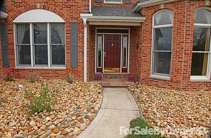 Front Entrance & Stonescaping
						:
						View of stonescaping surrounding the front door and porch.