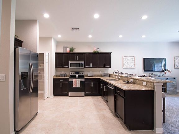 You will love the gourmet kitchen with granite - N