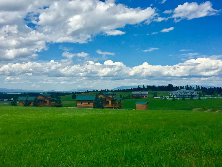 View of cabins facing north, small cabin on the left