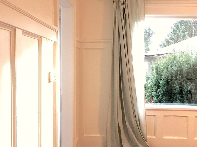 Large south-facing windows in dining room.