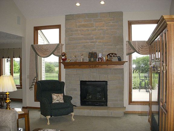 Lovely gas fireplace greets you as you enter the home
