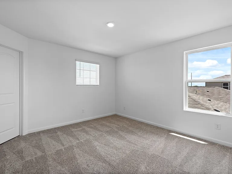 Two upstairs bedrooms feature their own walk-in closets.