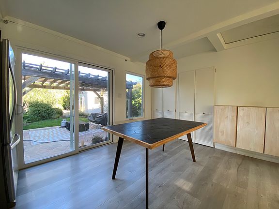 Dining area in the kitchen, with a sliding glass door to the back yard.