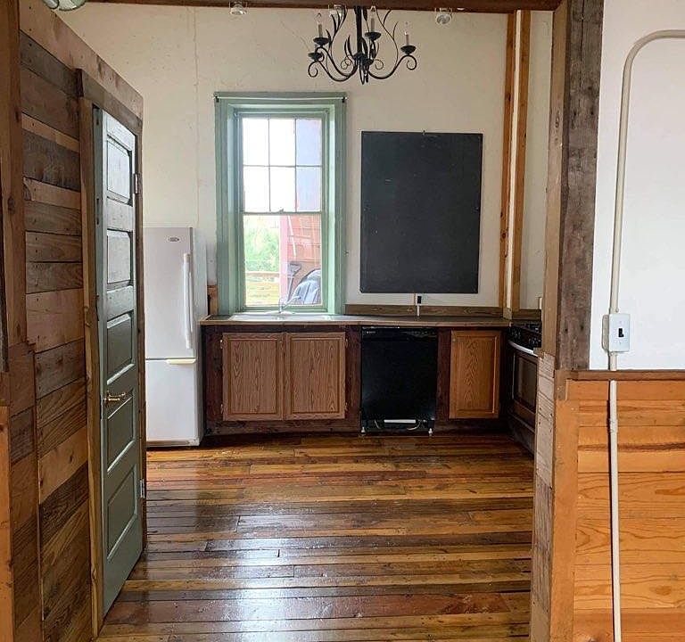 Kitchen with original part of blackboard. Stove, refrigerator, dishwasher and disposal are included.