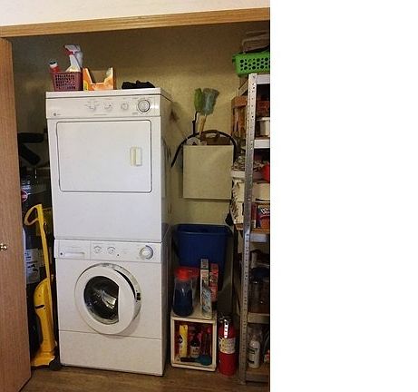 Utility closet, part pantry, laundry and water tank.