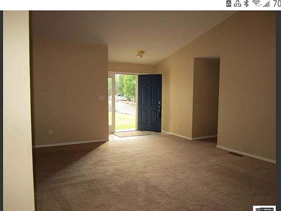 Living room from sliding glass doors to front door