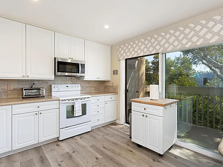 Kitchen is attached to an outdoor deck