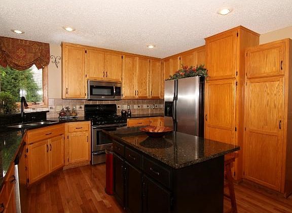 With granite counter tops, stainless appliances, hardwood floors and a corner sink with a view, this kitchen is sure to please the cook!