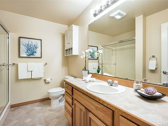 Primary bath off bedroom with shower and large vanity.