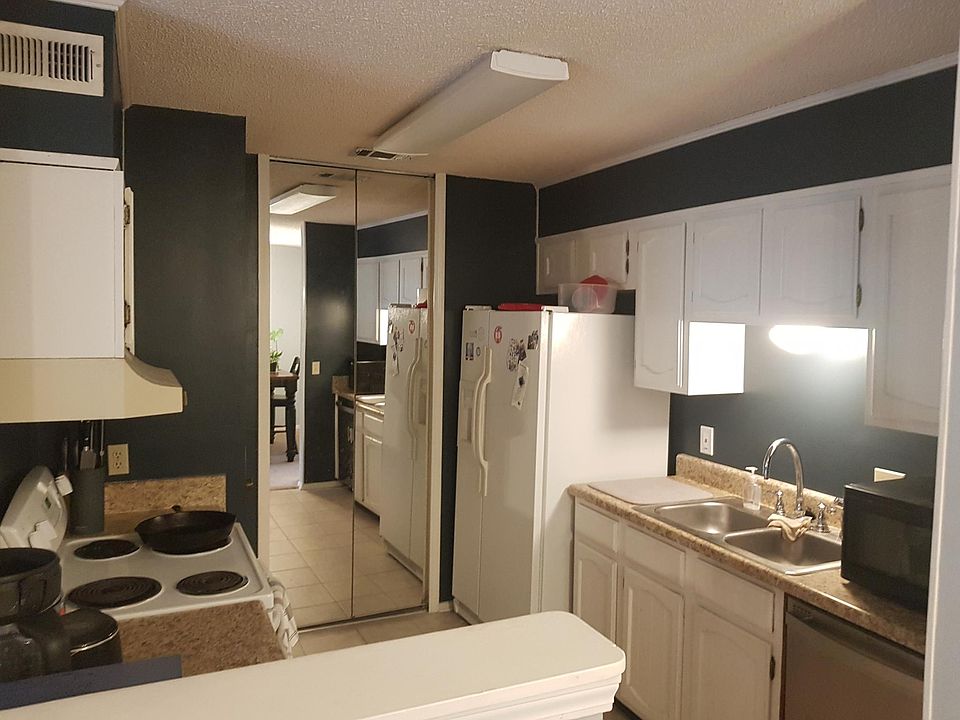 Open-plan kitchen with washer/dryer closet