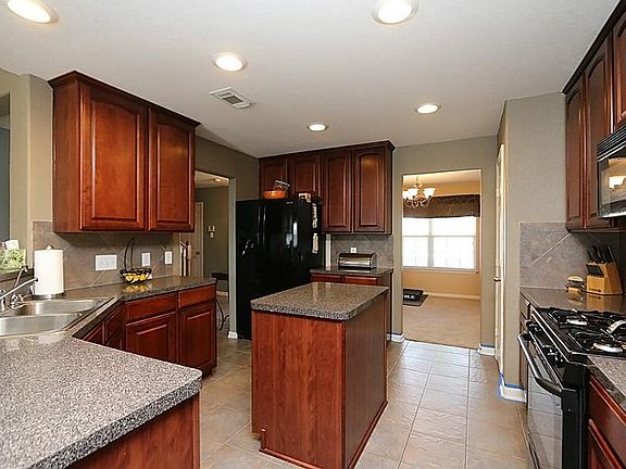 Lots of counter space and cabinets in this island kitchen
