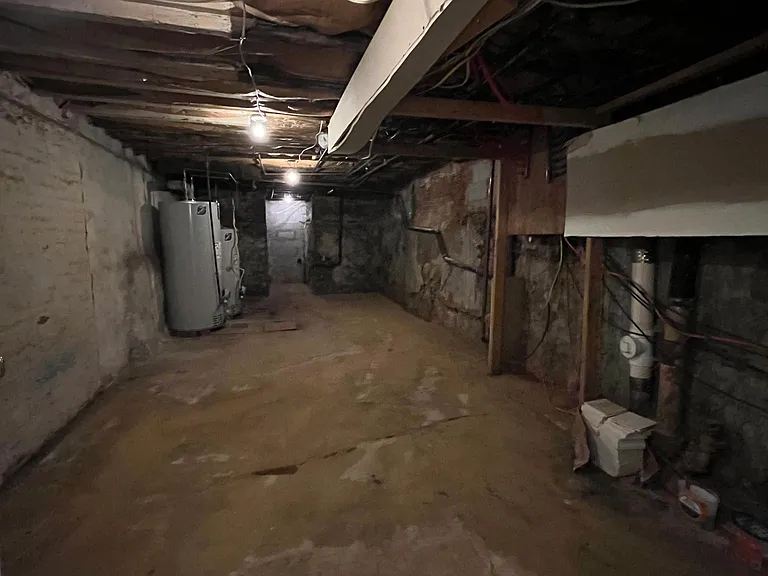 Unfinished portion of basement for seasonal storage