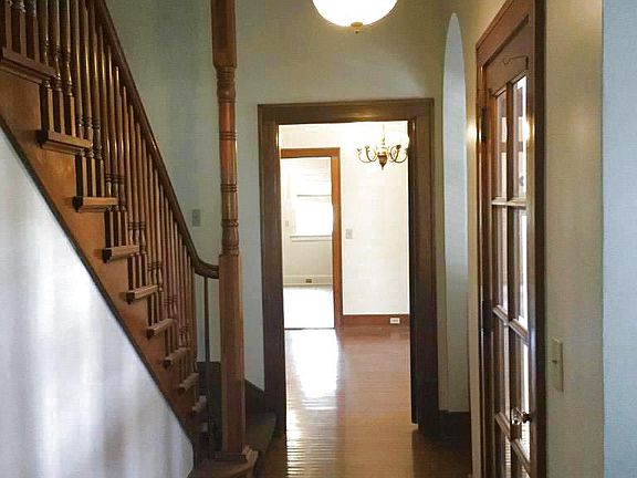 Front entry with stairway and gleaming hardwood floors.....formal grand entrance style