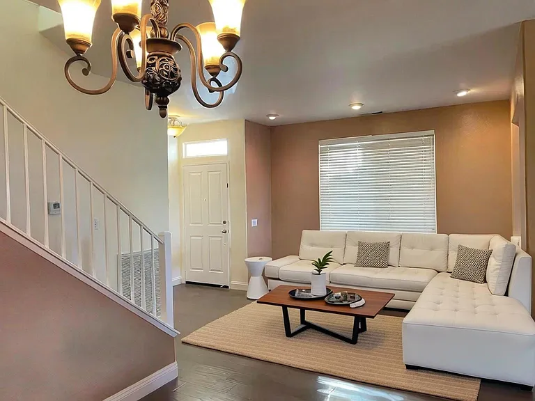 Another view of the front door entrance and living room