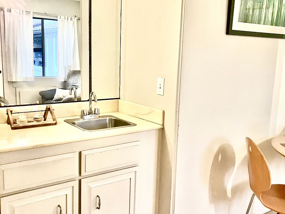 counterspace with mirror 
overhead lighting
standard size window