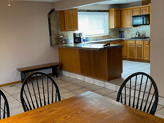 A unit Living Room looking into the kitchen.