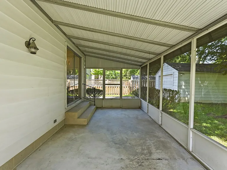 Screened-In Porch overlooking deep spacious yard.
