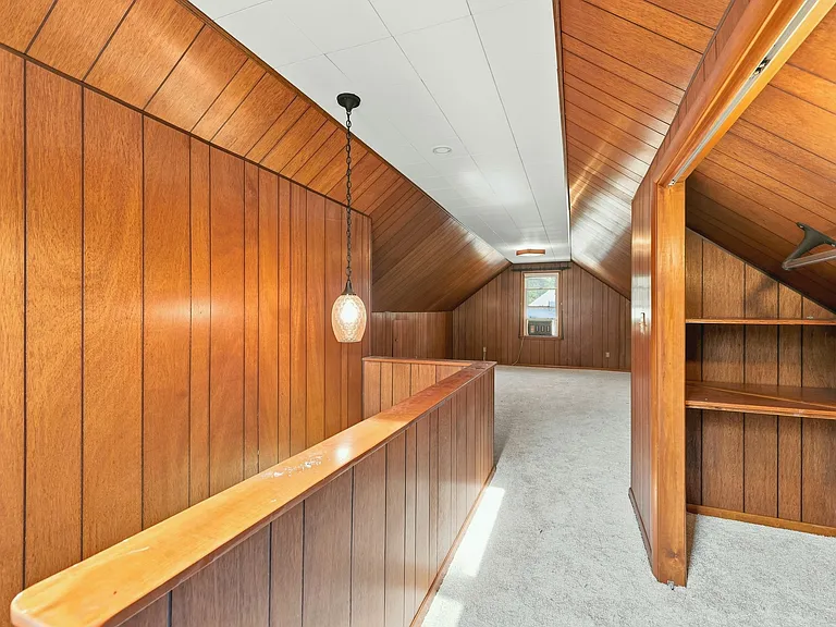 The third bedroom upstairs - brand new carpet throughout and its own air conditioning unit. Includes its own closets, storage cabinets, and door for privacy!