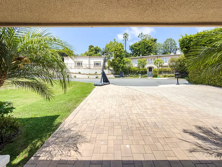 Elegant brick paver driveway sets a grand tone for this Beverly Hills luxury rental at 1094 Garden Lane, a coveted 90210 lease.