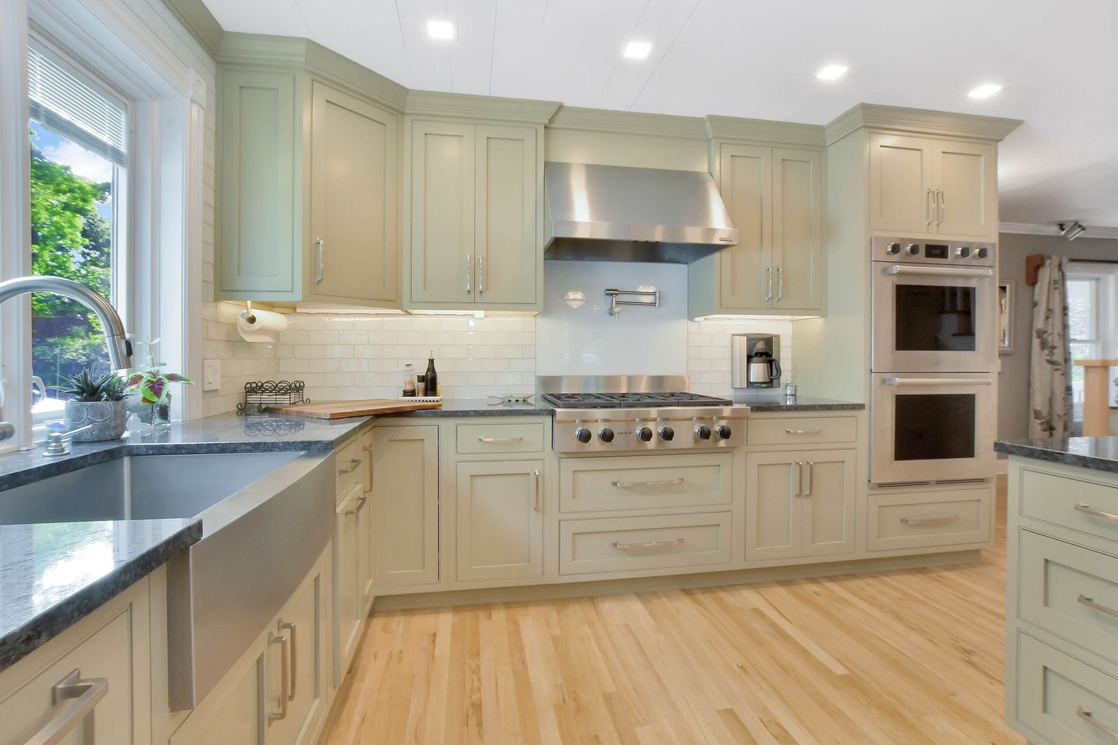  Kitchen Featuring Stainless Steel Appliances, Black Granite Countertops, Wolf 6 Burner Gas Cooktop