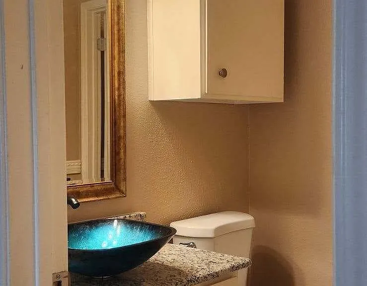 New granite vanity and vessel sink.