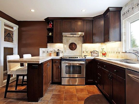 Double pantry in Kitchen, under cabinet lighting, dimmable recessed lighting, stainless appliances.
