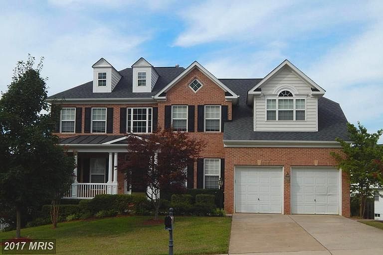 Striking Home w/Front Porch and Brick Front