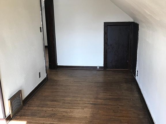 living room with 2 storage closets, one runs the full length of the house