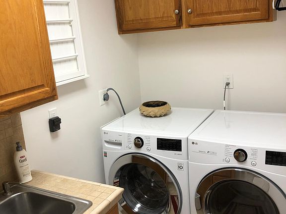 Laundry room complete with storage and sink