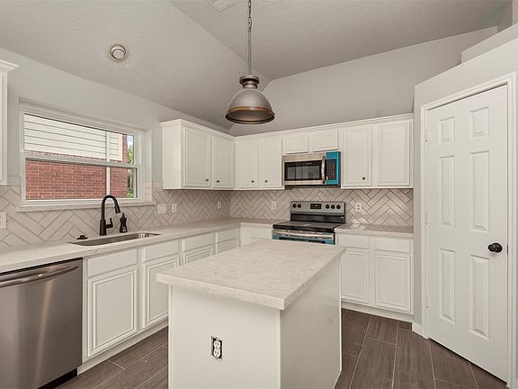 Renovated Kitchen with Stainless Steel Appliances and Walk-in Pantry