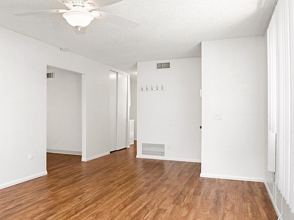 New hardwood flooring and mini blinds in family room